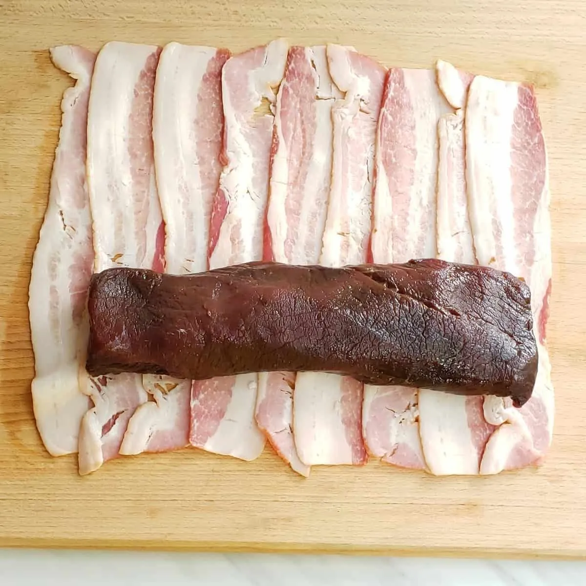 Bacon Wrapped Venison Backstrap Roast