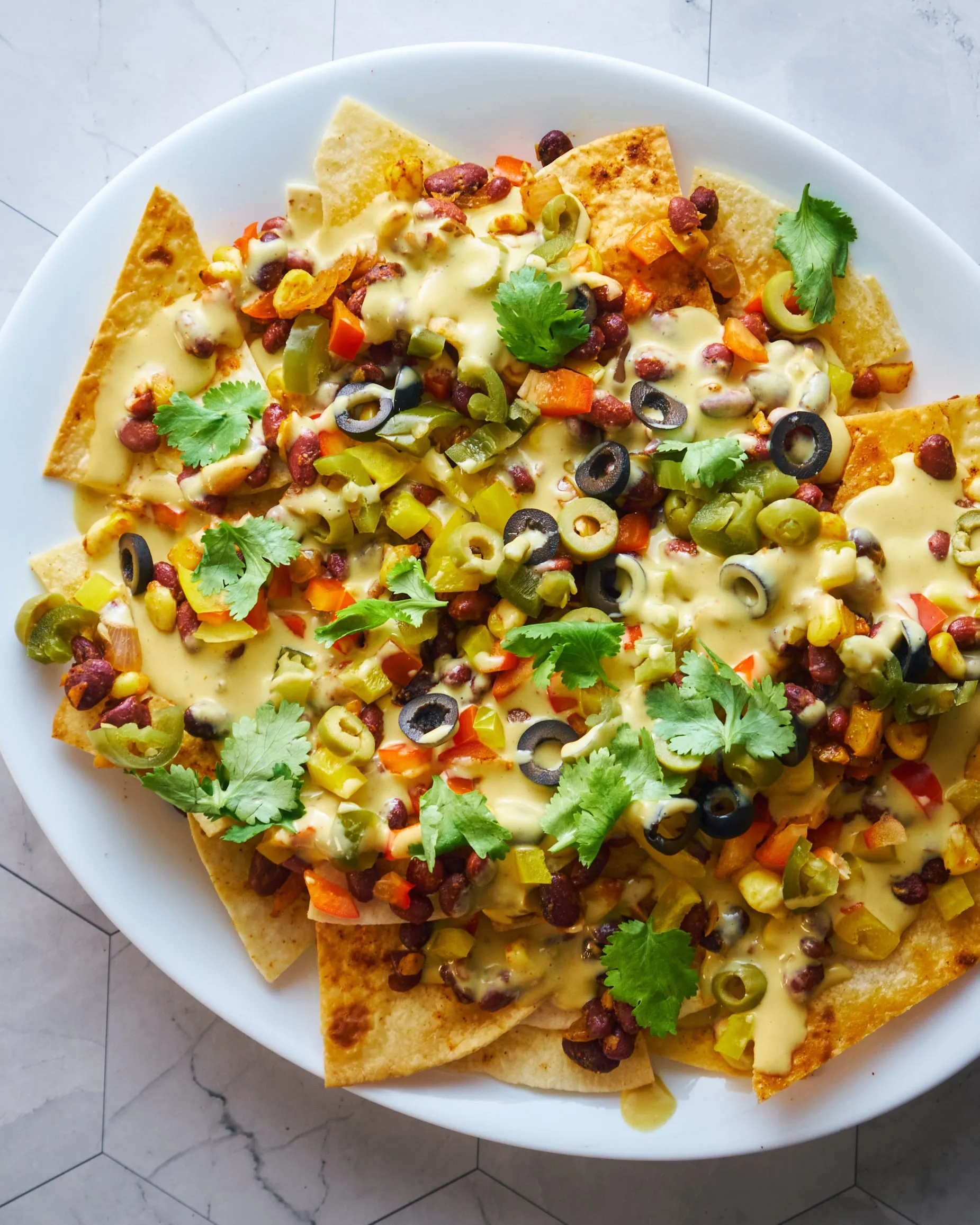 Bell Pepper Nachos with Cauliflower Taco Meat and Vegan Nacho Cheese Sauce