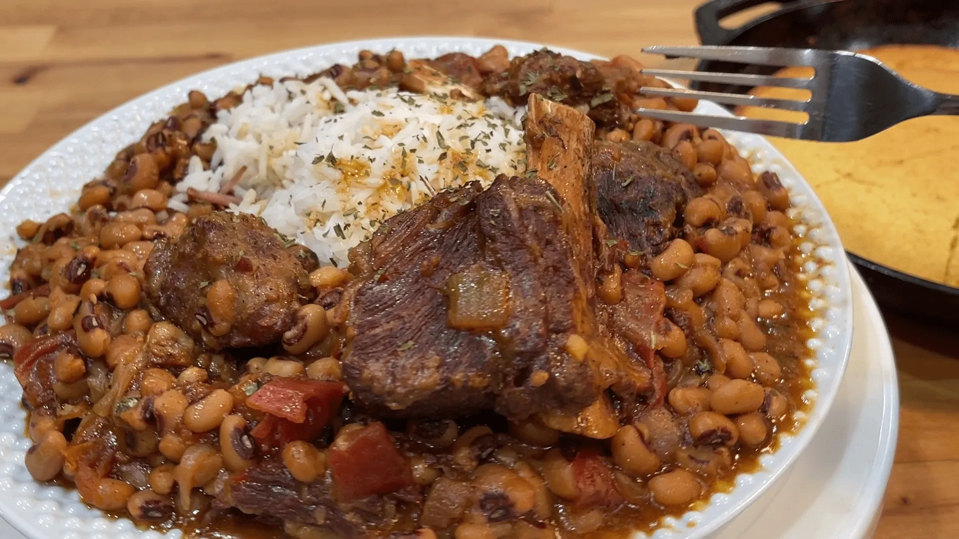 Braised Short Ribs with Black Eyed Peas and Cannellini Beans in a Chipotle Beef Gravy