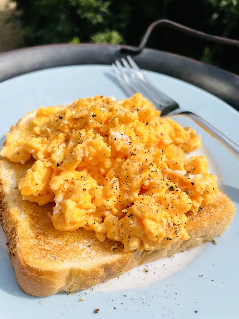 Cheesy Scrambled Eggs on Tomato Toast