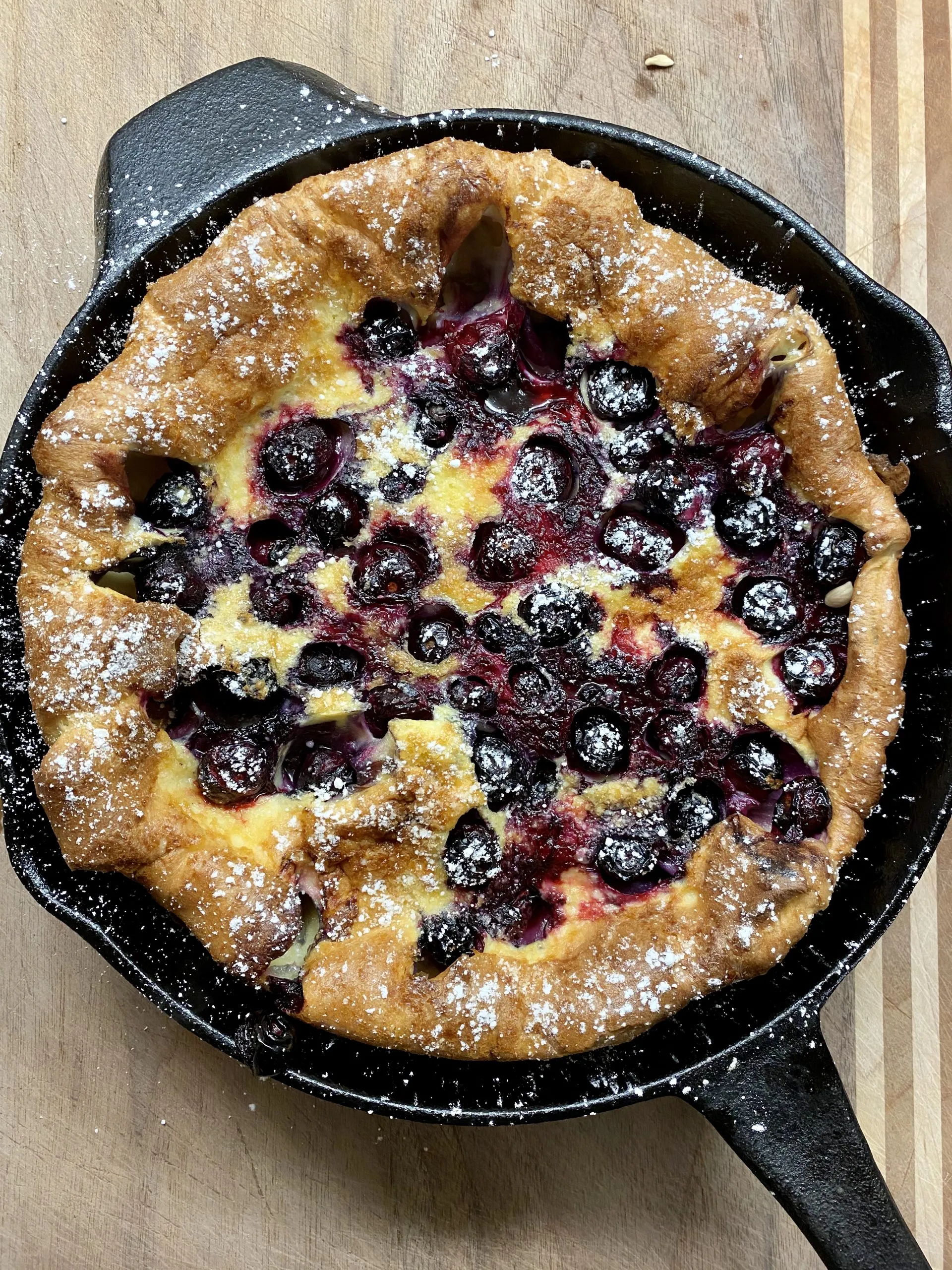 Peach Dutch Baby with Blueberry Sauce