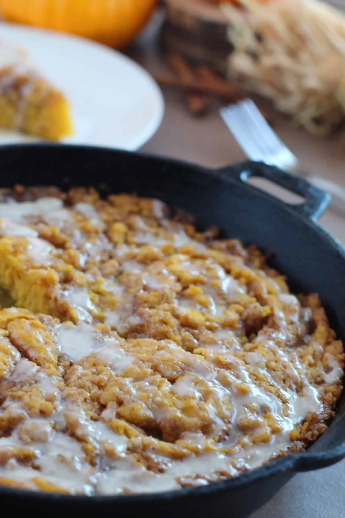 Pumpkin Sticky Roll Skillet Cake with Cinnamon Tahini Cream Cheese Icing