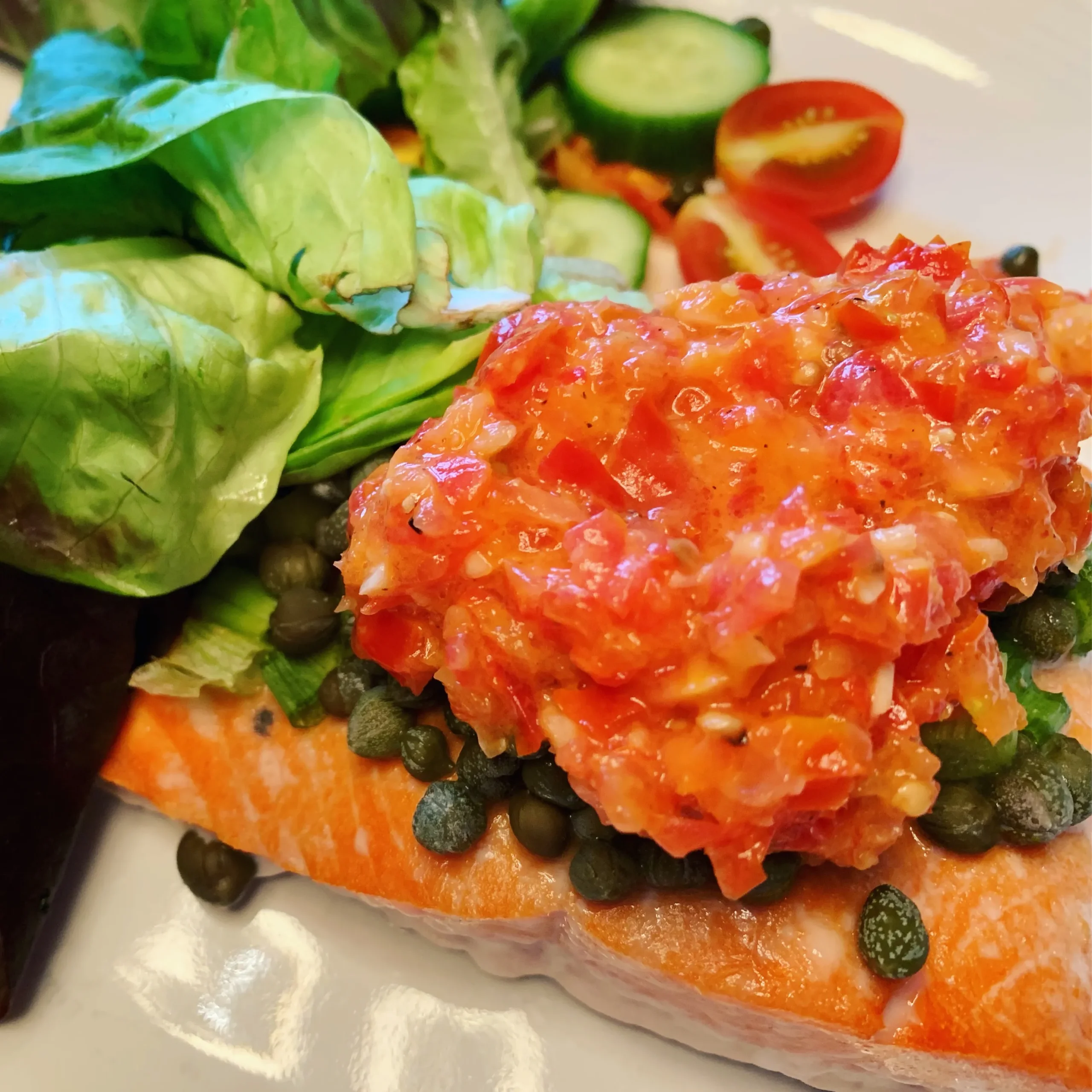 Salmon with Arugula, Tomato, and Caper Sauce