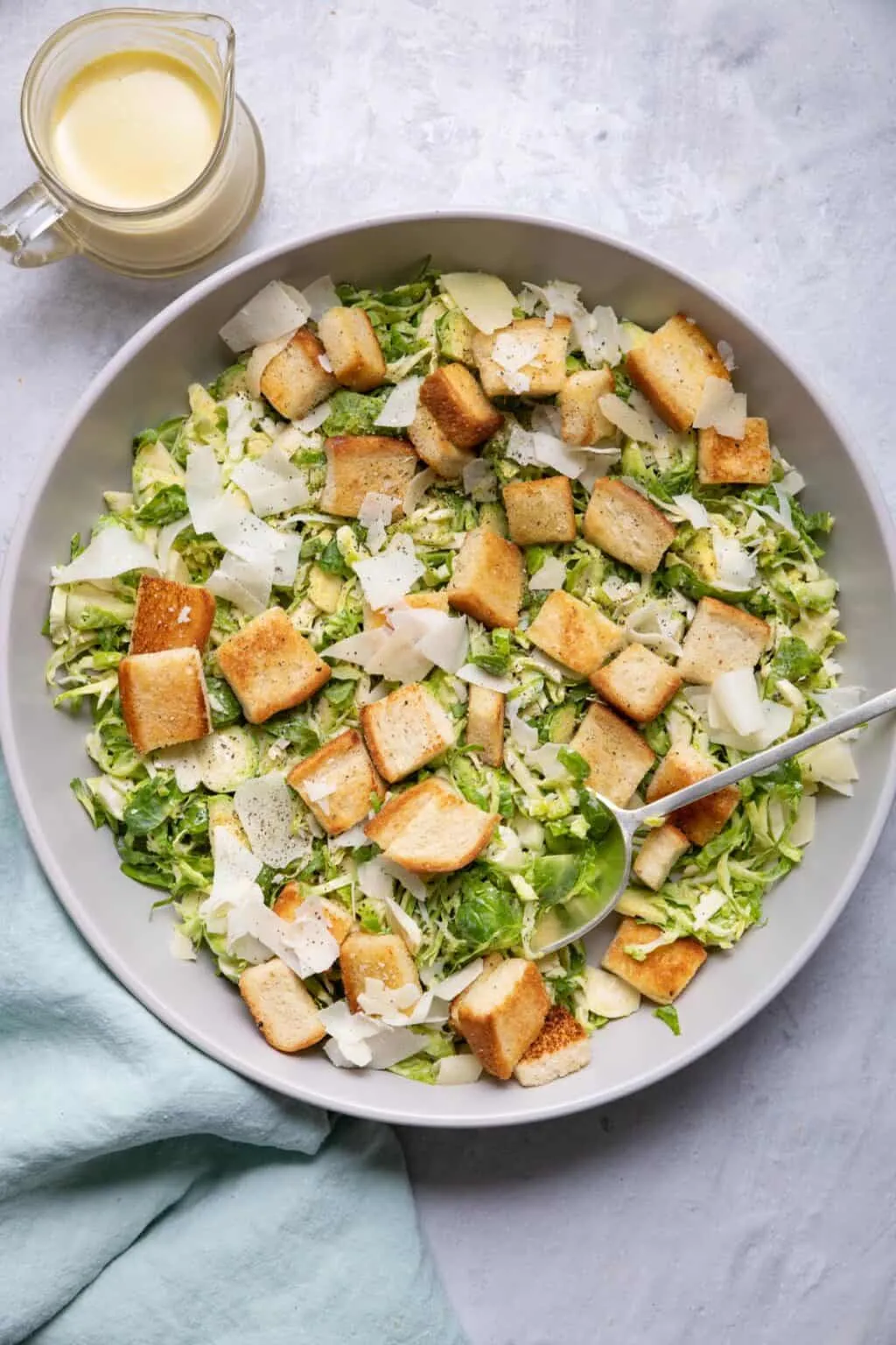 Shredded Brussels Sprouts Caesar Salad with Homemade Croutons