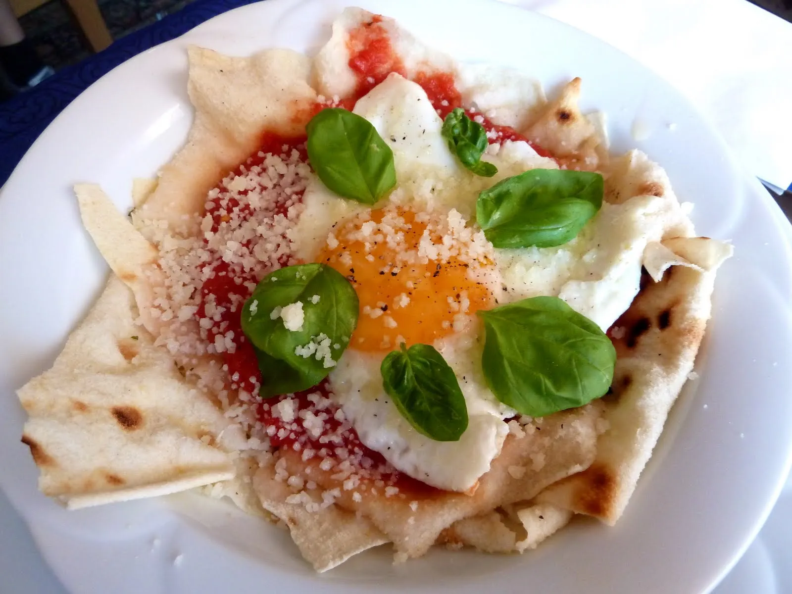 Tomato Poached Eggs with Sardinian Music Bread