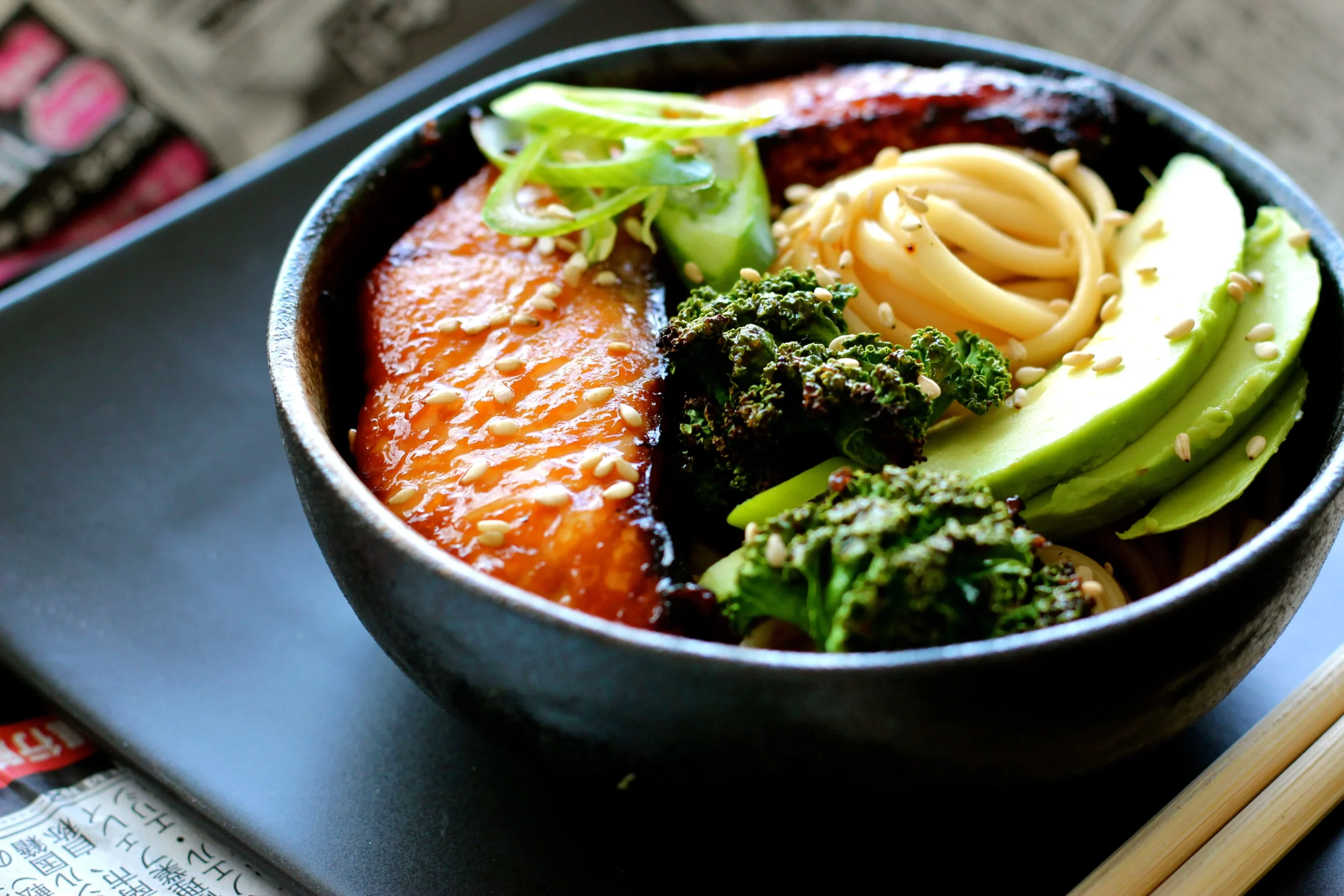 Udon Noodle Bowl with Miso Honey Glazed Salmon, Avocado, and Crispy Kale