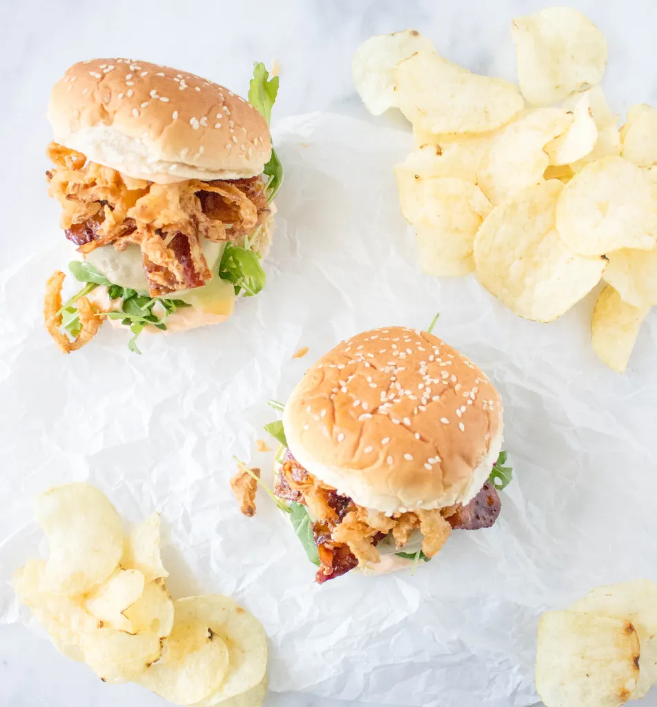 cheeseburgers with stout glazed bacon crispy onions sriracha aioli