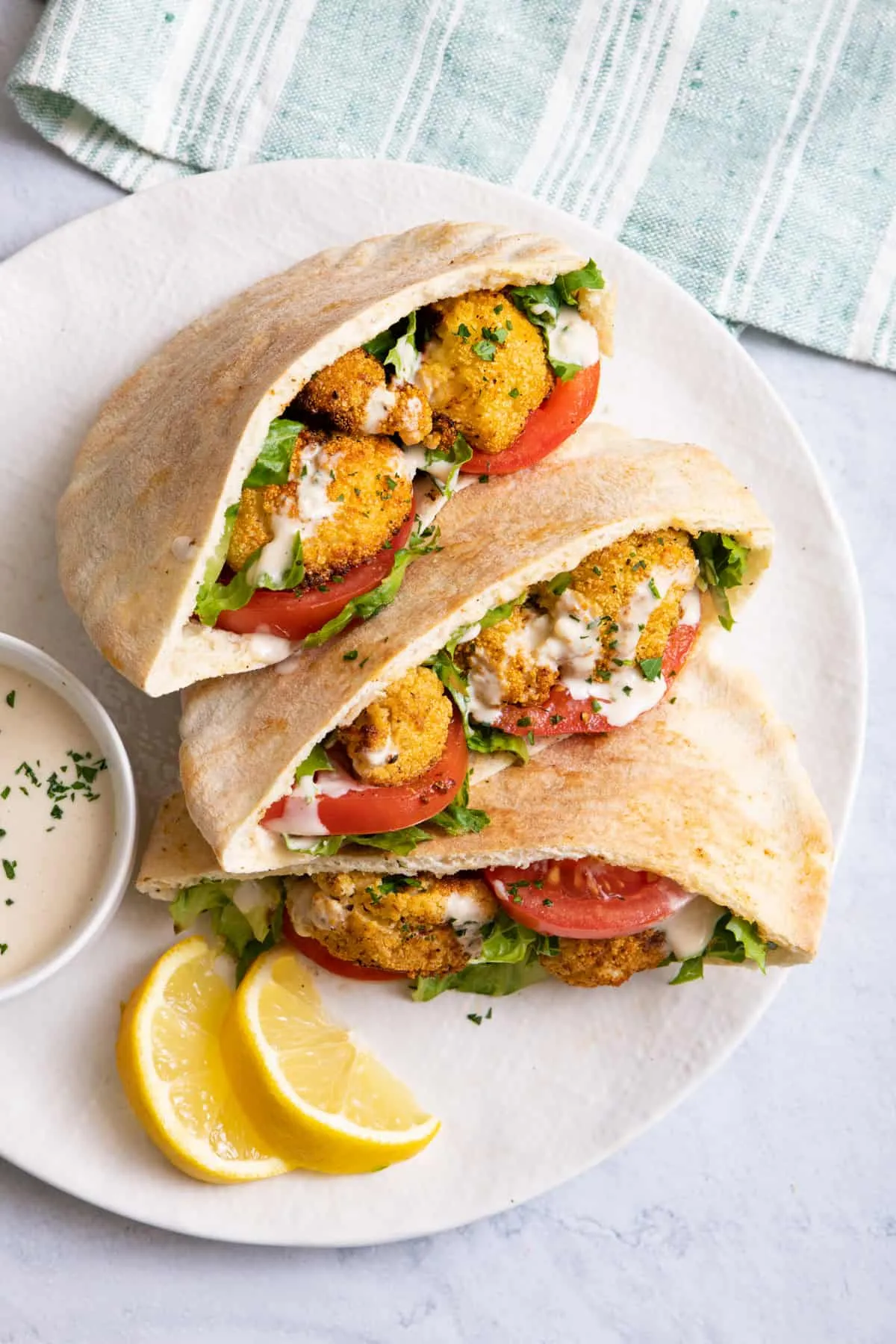 roasted lemon cauliflower halloumi pita pockets with a vegan aioli