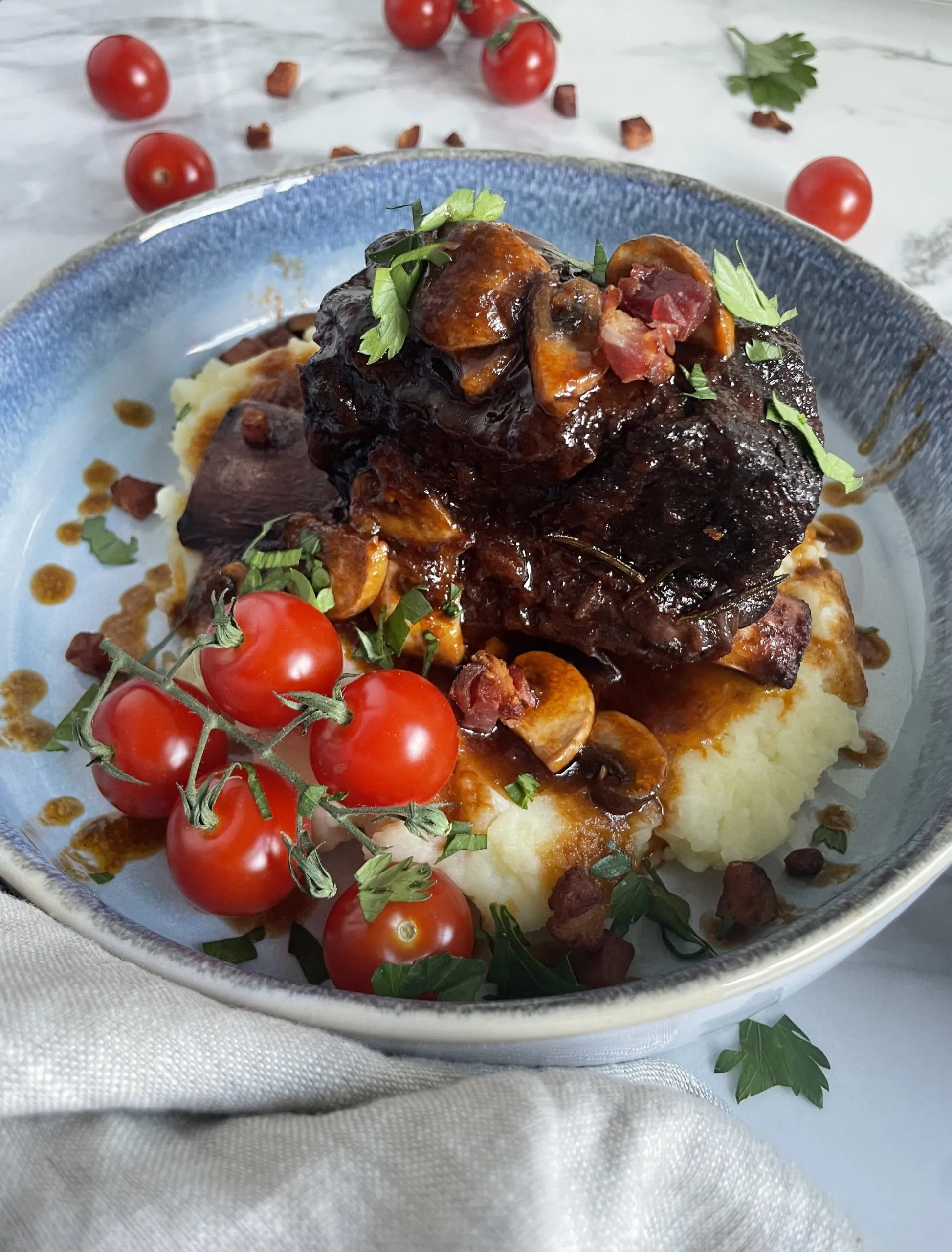 savory braised short ribs with vegetables and artichoke hearts