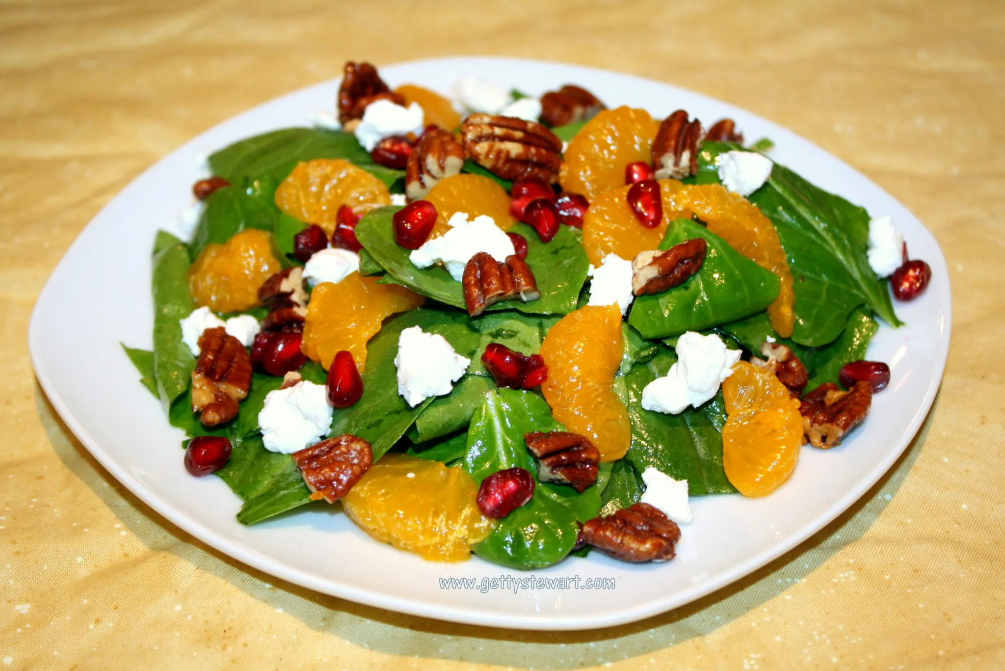 spinach and oyster mushroom salad with mandarin oranges and pecans